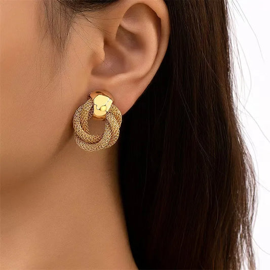 A pair of trendy stud earrings - Exquisite, minimalist, unique, and creative jewelry perfect for ladies to wear at parties.